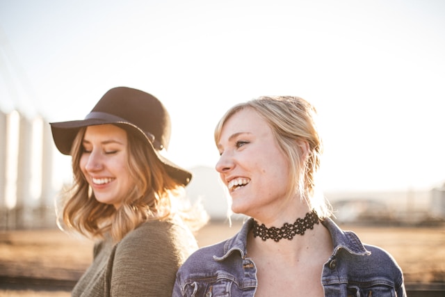 two female friends laughing 