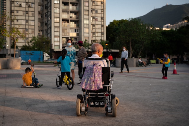 Old man in a wheelchair in a park