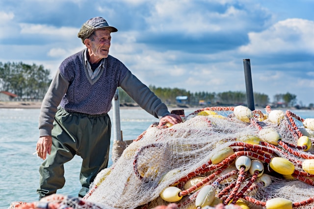 old man with fishing net