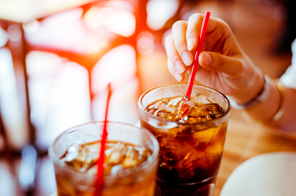Two glass soft drink with ice in restaurant background