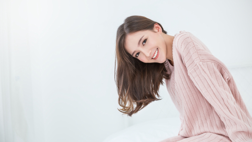 Portrait smile happy beautiful innocence asian woman relax bedroom Asian girl face winter cloth Beauty long hair spa woman treatment perfect clear cosmetology skin Japanese girl makeup hygge lifestyle