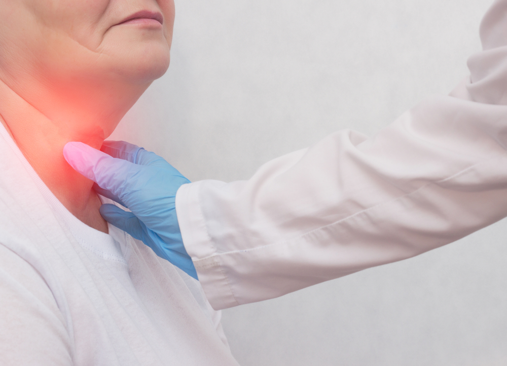 Adult woman on reception at the doctor who has problems with the thyroid gland and the endcrine system, close-up, patient
