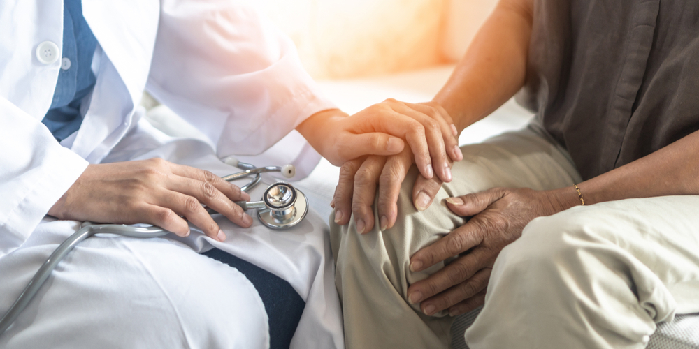 Parkinson's disease patient, Arthritis hand and knee pain or mental health care concept with geriatric doctor consulting examining elderly senior aged adult in medical exam clinic or hospital
