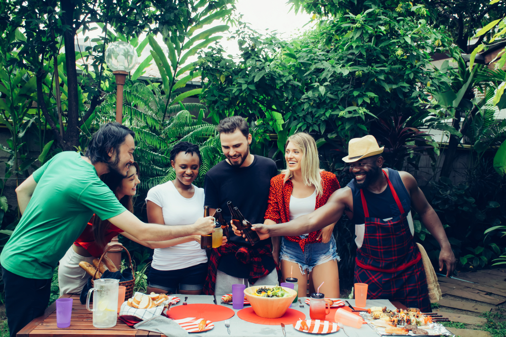 Group of friends having a barbecue party in nature. barbecue and party.
