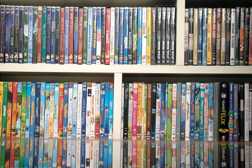 SAO PAULO, SP, BRAZIL - SEPT 2nd, 2020: A shelf full of DVD movies for family. Fun audio visual films for children. Selective focus.
