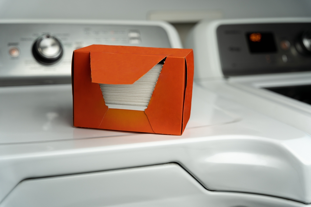 Dryer sheets sitting on a washing machine used for freshening clothes and static removal. Also used for fresh aroma and dryer sheet hacks.
