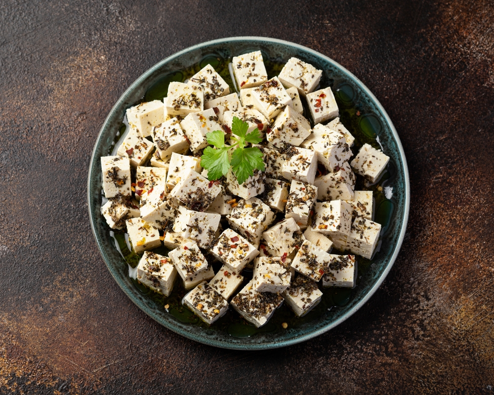 Vegan Tofu feta cheese with dried oregano, basil, thyme and garlic. Healthy Food.
