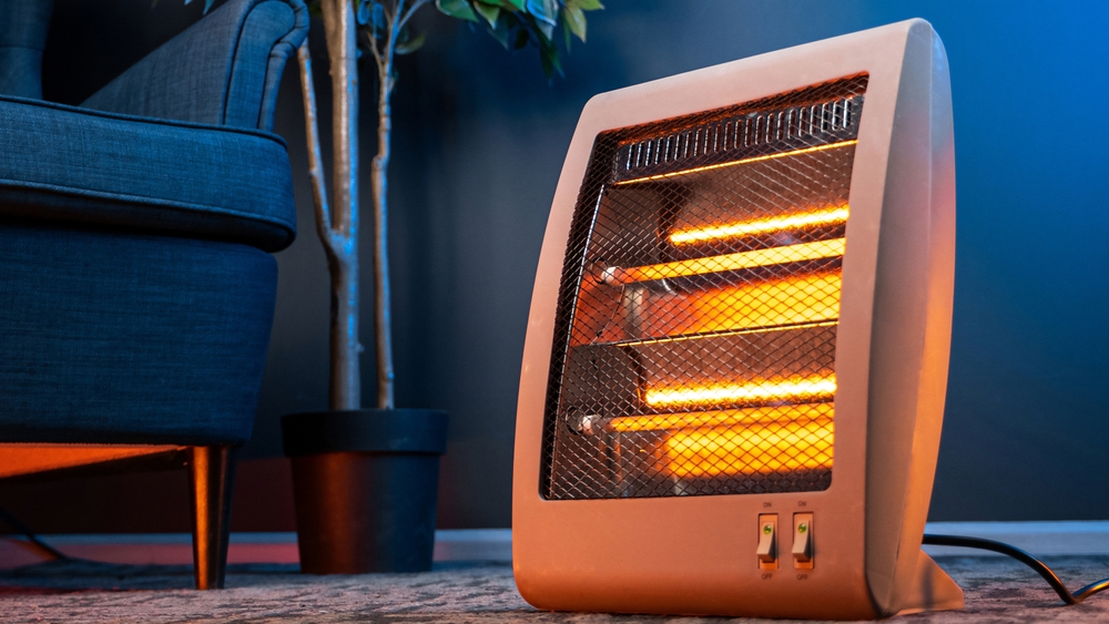 Modern electric infrared heater in the living room
