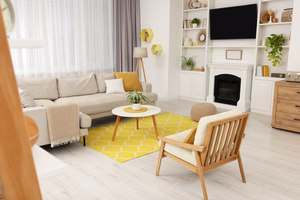Spring atmosphere. Stylish room interior with cozy furniture in yellow and white colors
