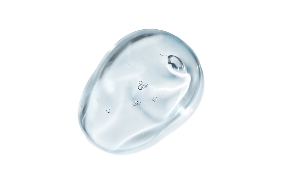 Serum gel swatch isolated on white background. Cosmetic transparent gel serum texture.