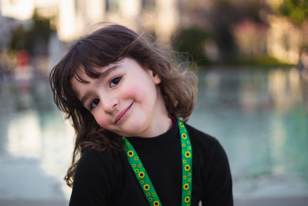 Girl with autism identification necklace

