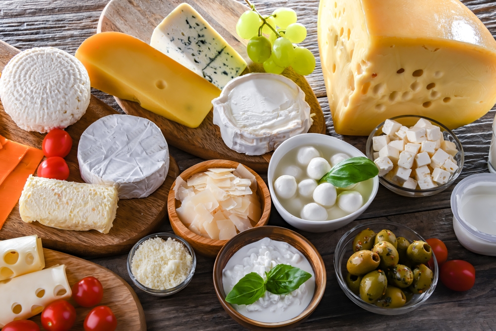 A variety of dairy products including cheese, milk and yogurt.