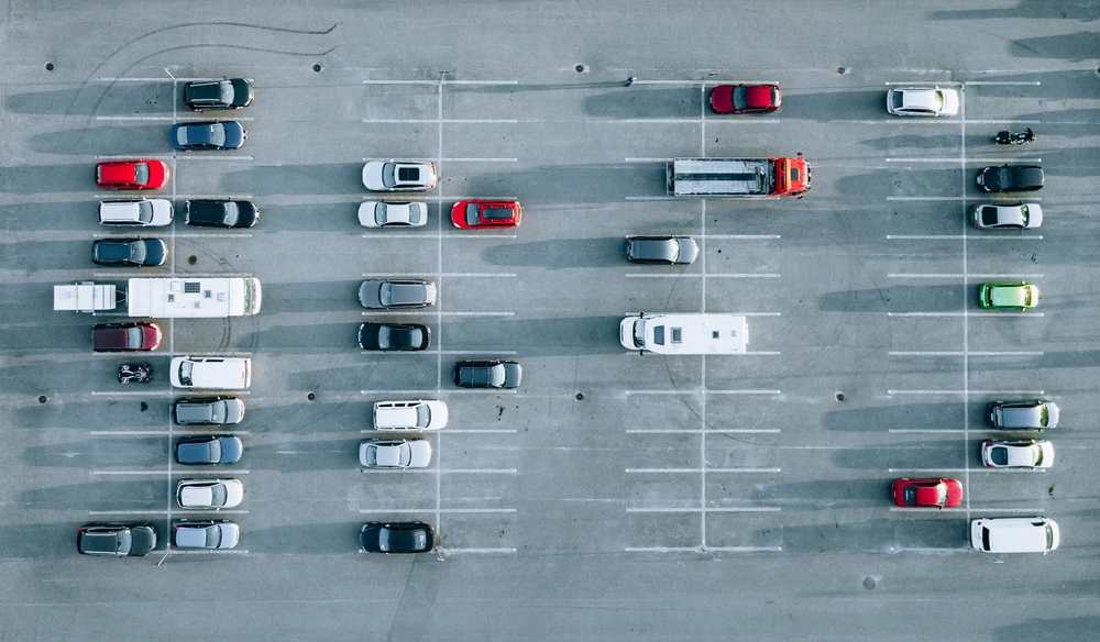 Aerial view of cars at car park, almost empty parking lot in Fin
