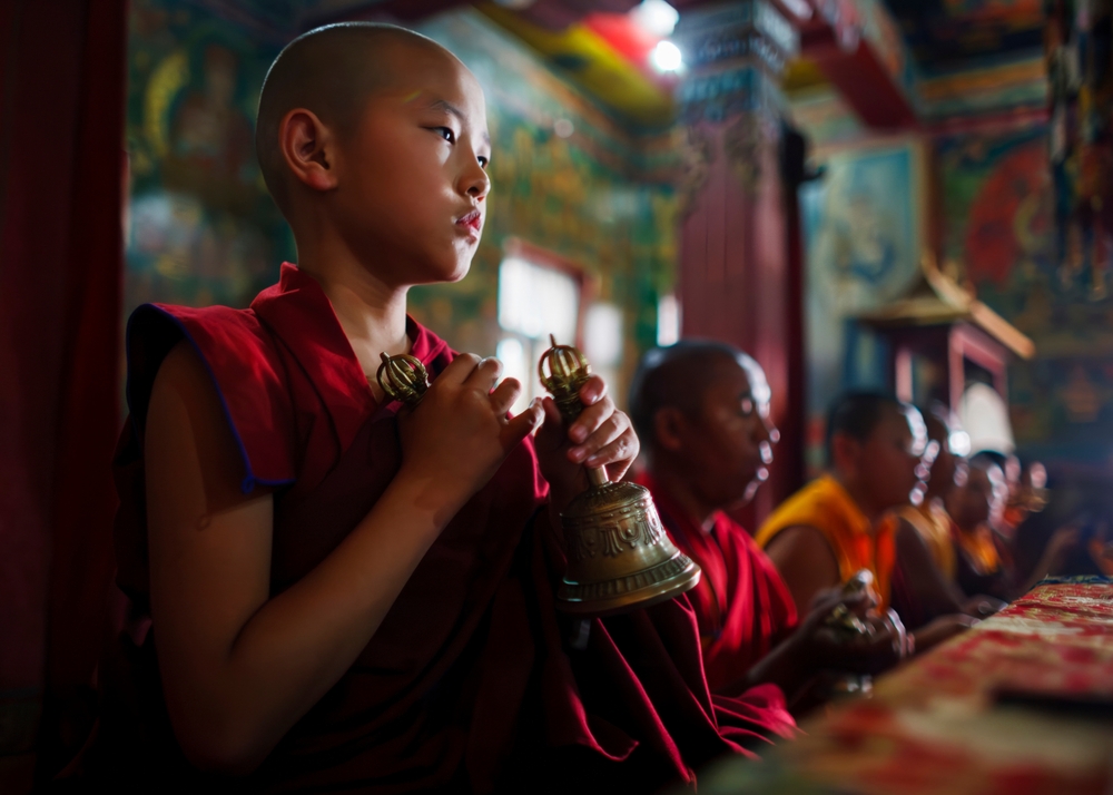 Tibetan Buddhist monks take part in an afternoon puja at a monastery near the Bodhnath stupa in Kathmandu, Nepal April 17, 2010.