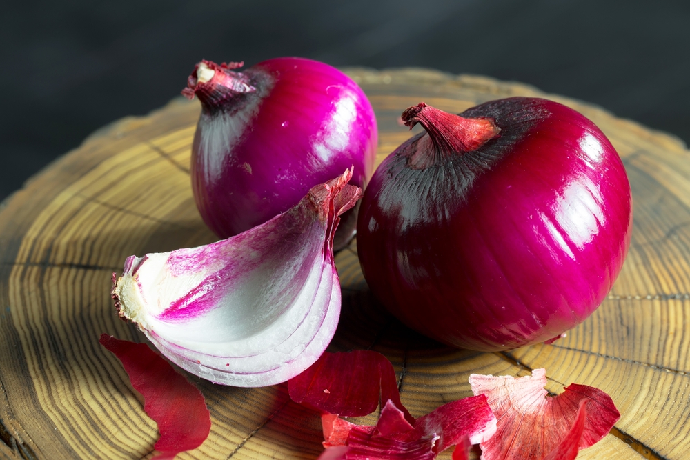 Red onion on an old background, a spicy vegetable, for preparing delicious healthy food. Healthy natural food high in vitamins.
