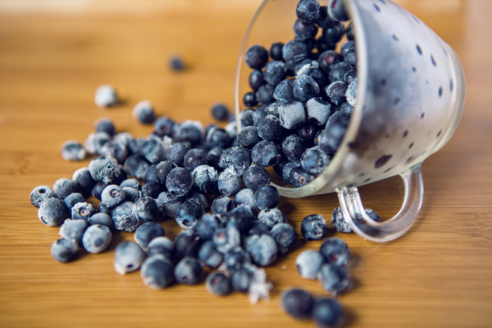 frozen blueberries in a transparent glass Cup
