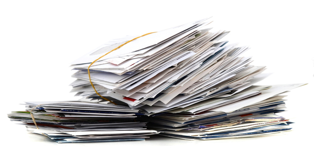 Pile of mails on white table
