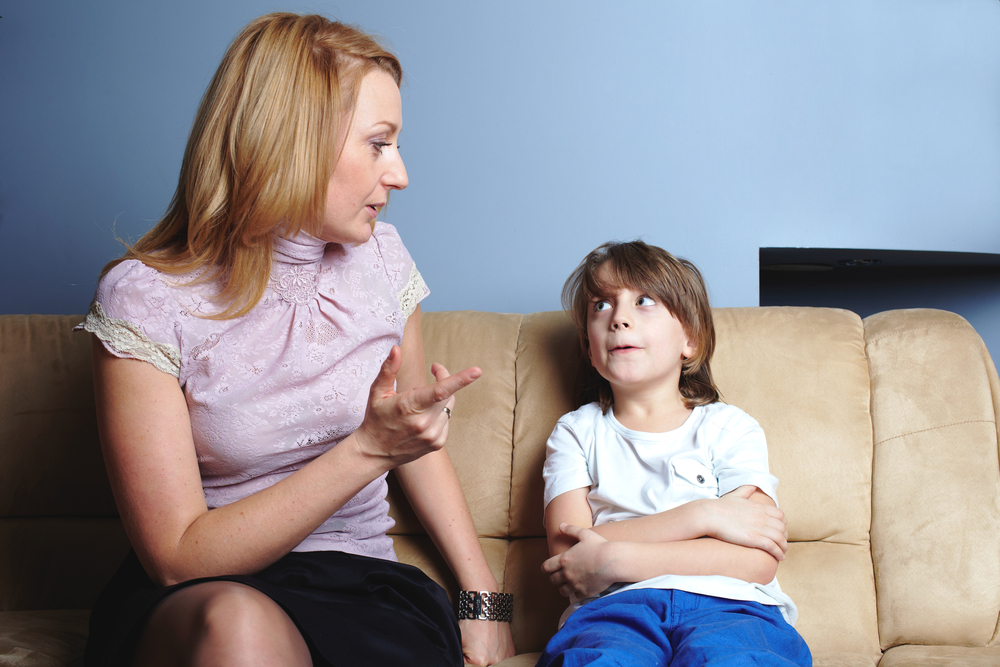 Angry mother talks to her son, give him a warning