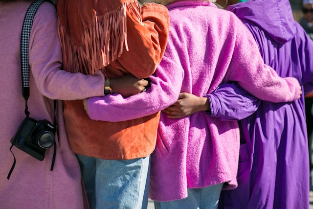 group of people hugging 