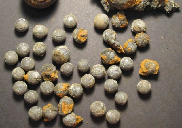 An array of munitions were also found on board, including a French-made cannonball and the American-made musket balls pictured.