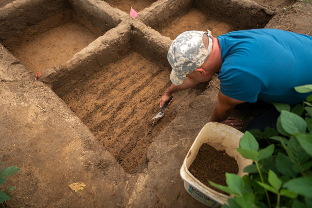 A man digging for more clues and information