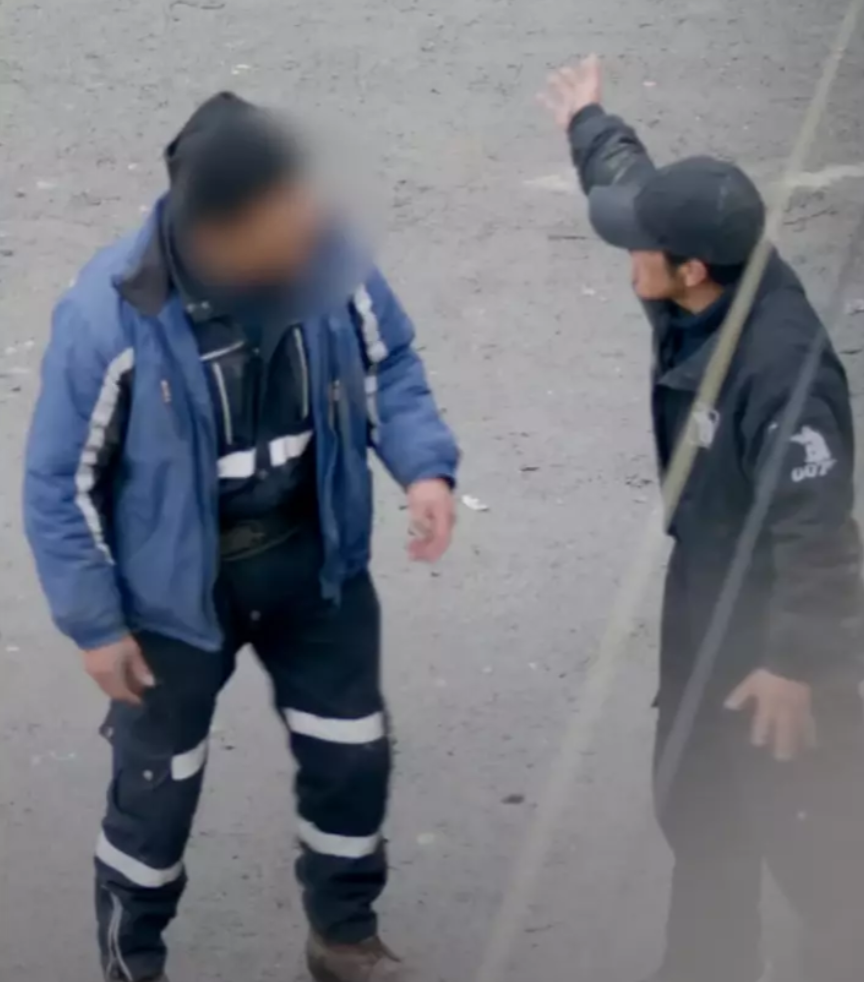 Two men arguing in the street