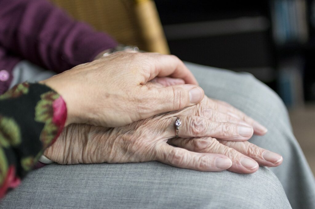 old persons hand at end of life