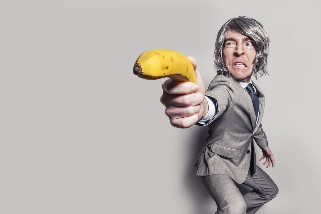 man wielding a banana