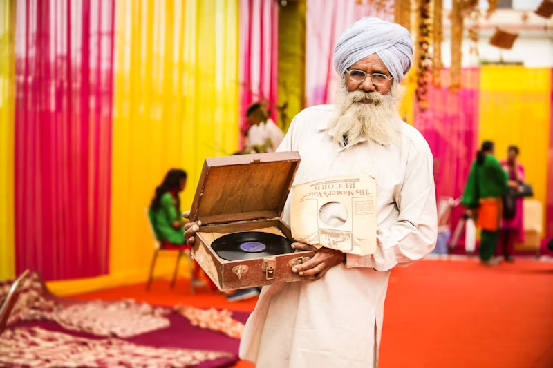 Elder gentleman holding a record in a box