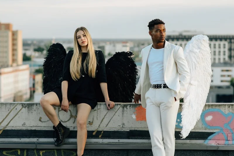 Man and woman posing with wings like immortal beings