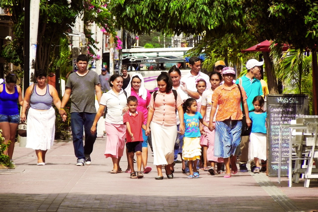 Group of Hispanic people walking down the street