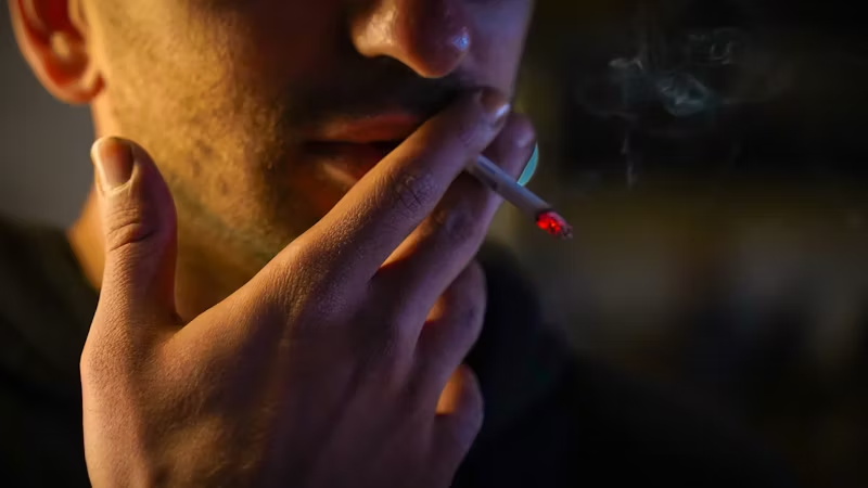 man smoking at night