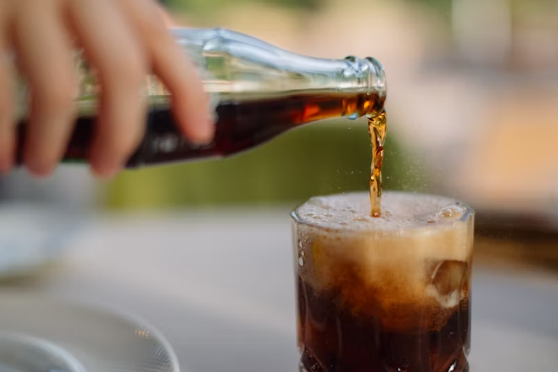 soft drink being poured into a glass