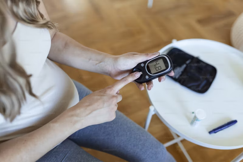 diabetic person checking their blood sugar