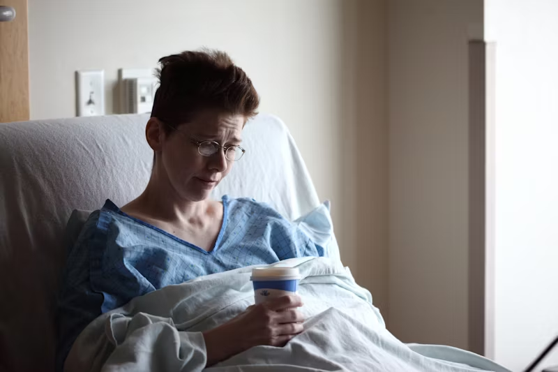 A person i the hospital looking solemn