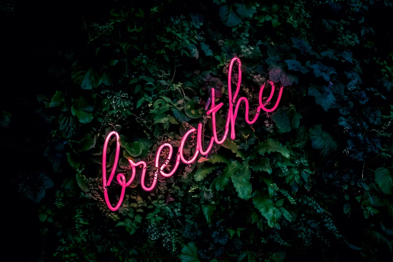 neon sign "breathe"