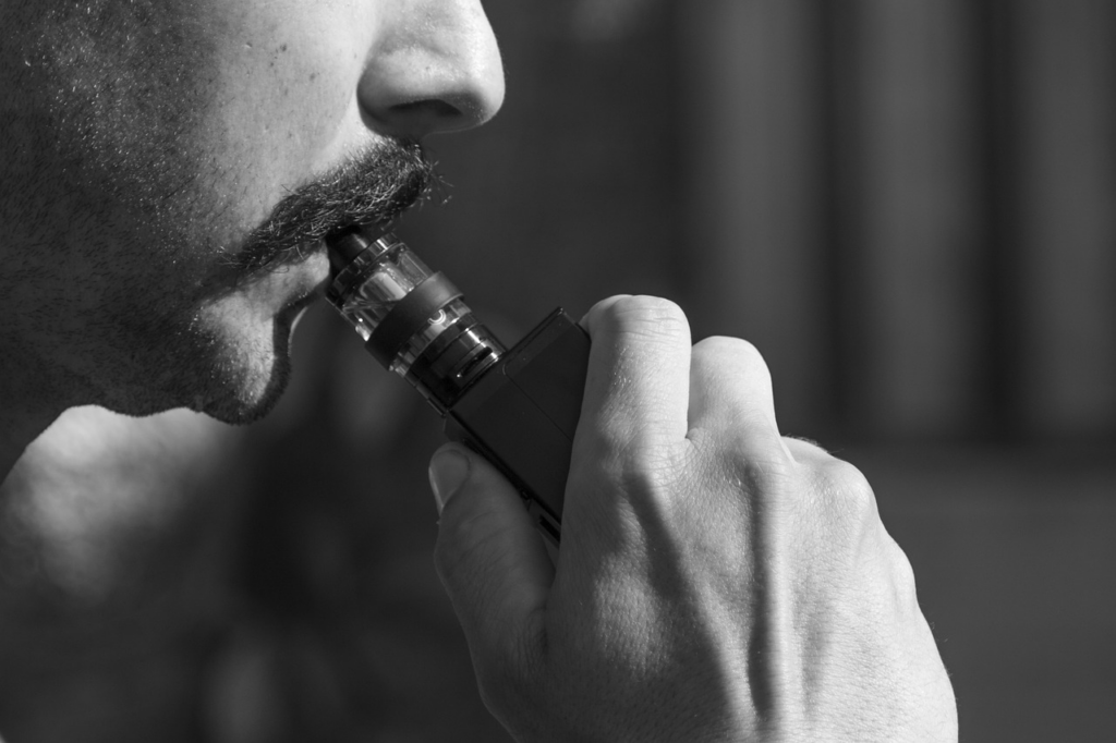 Man vaping in black and white