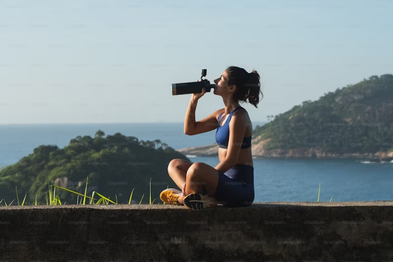 woman sitting and hydrating