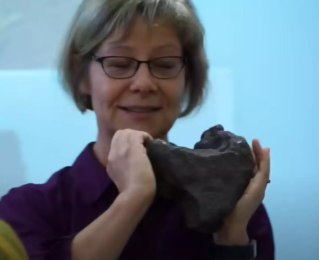 Researcher Monaliza Sirbescu with the rock 