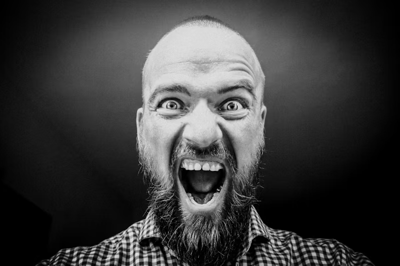 bearded person screaming