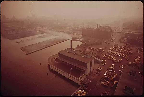 In Delaware, the city incinerator billows out smoke over the river.