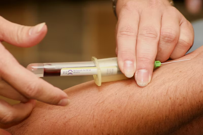 blood being collected from someone's arm