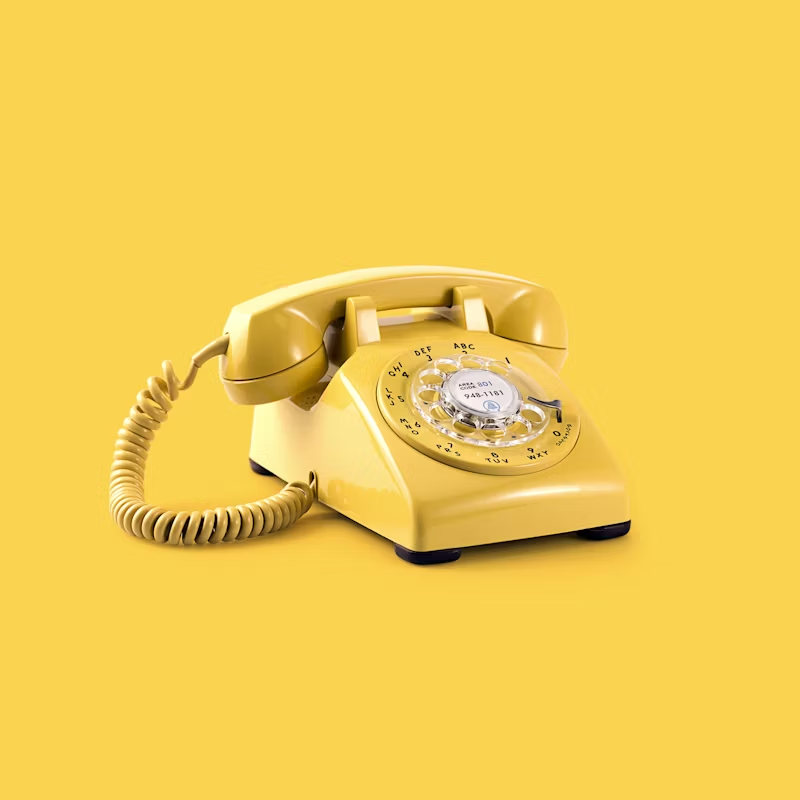 yellow phone on a yellow backdrop
