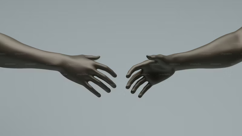 Two hands reaching out to each other