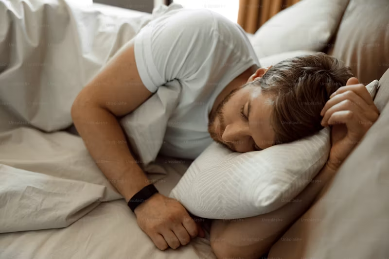 man sleeping on his left side