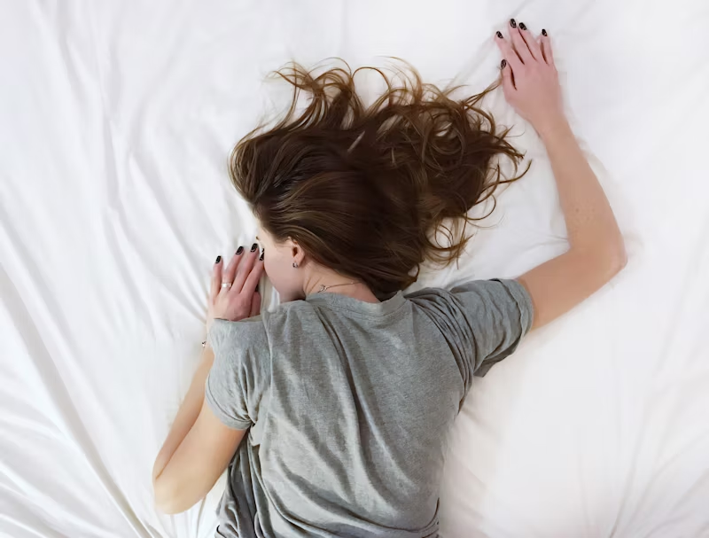 woman asleep on her stomach