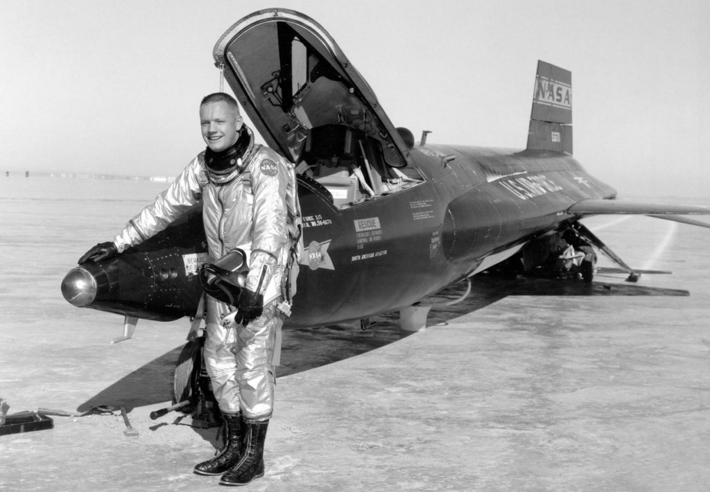 Neil Armstrong is seen here next to the X-15 ship #1 after a research flight. The X-15 was a missile-shaped, rocket-powered aircraft 50 feet long with a wingspan of 22 feet. It set the world's unofficial speed and altitude records. Information gained from the highly successful X-15 program contributed to the development of the Mercury, Gemini, and Apollo manned spaceflight programs, and also the Space Shuttle program. 