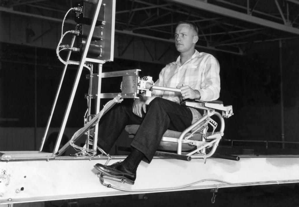 Neil Armstrong was a test pilot at the Dryden Flight Research Center in the 1950s and early '60s. He is seen here operating the Iron Cross Attitude Simulator reaction controls simulating the X-15. 