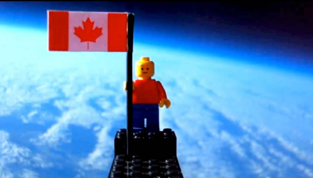 This still from a video uploaded to YouTube by Toronto 17-year-olds Mathew Ho and Asad Muhammad shows their homemade balloon launch of a Lego minifigure into the stratosphere to catch views of near space.