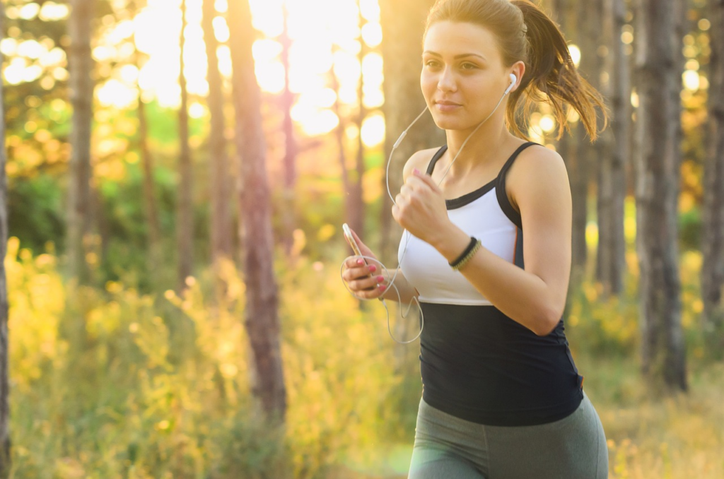 woman jogging in forested area